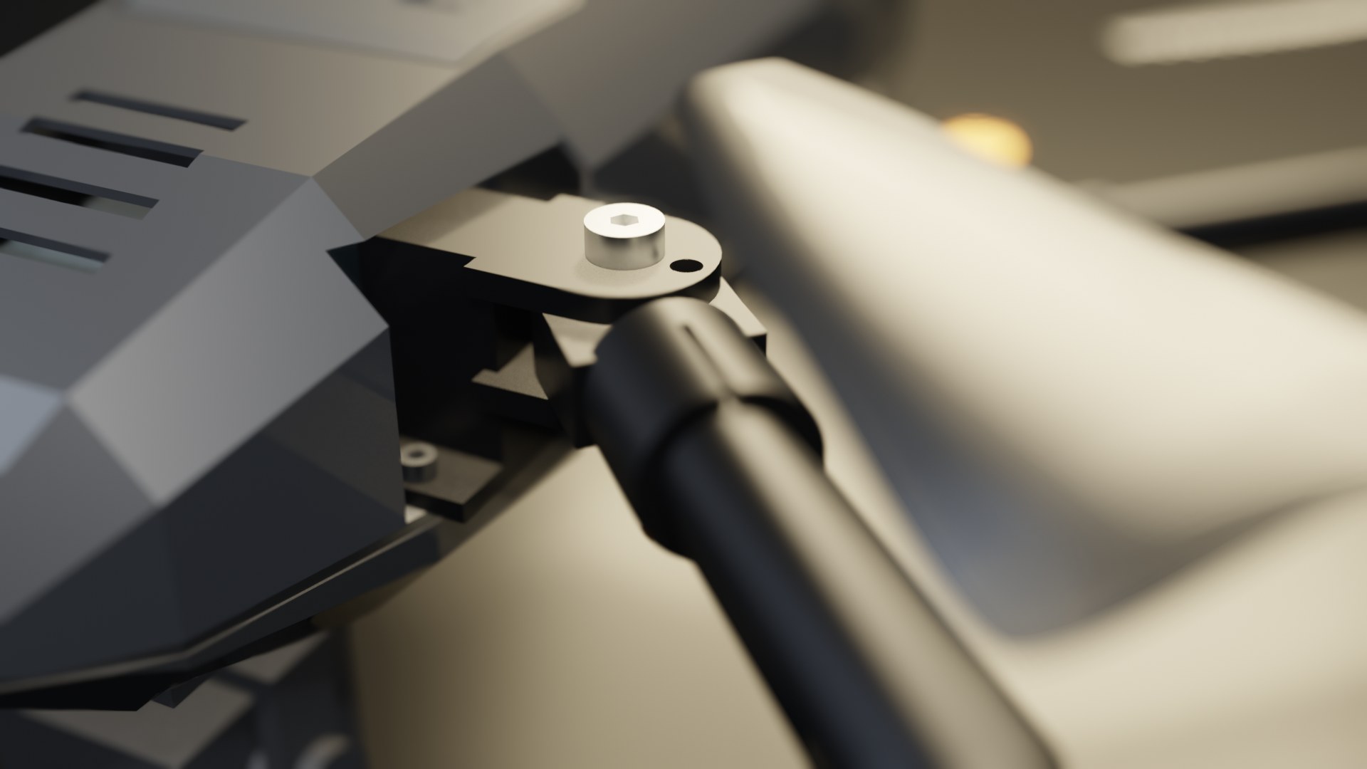 Close-up of the front-left arm hinge: machined clevis, shoulder screw and the clamped arm root on its aluminium tube